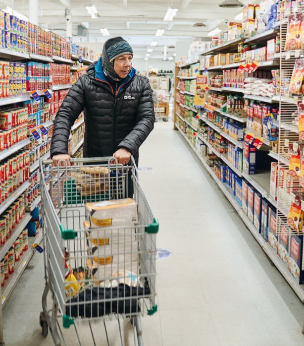 Eric with shopping cart in supermarket